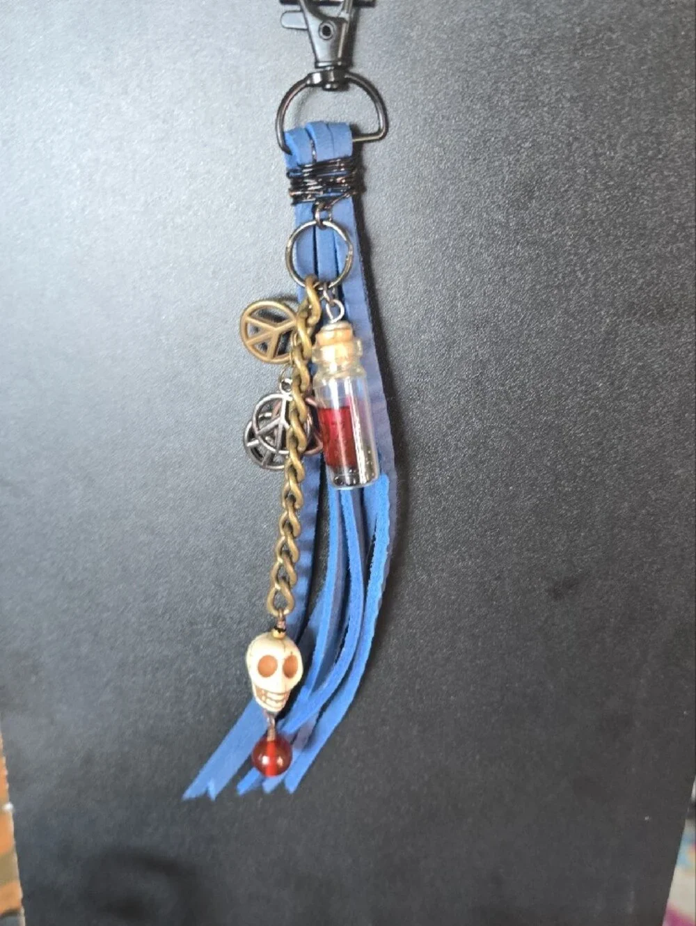 Blue Tassel Keychain with Skull and Charm Accents